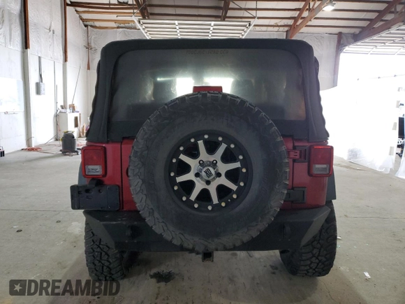 2012 Jeep Wrangler Sport with VIN 1C4AJWAG5CL233049, listed as a Copart auction lot 52328865 with 185,388 mi miles and Salvage title. Bid and sale history available at DreamBid. Image 6.