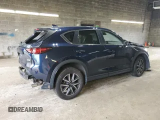 2018 Mazda CX-5 Touring z VIN JM3KFBCM3J0464815, wystawiony jako Copart lot #58794685 z przebiegiem Nie podano mil oraz Szkoda całkowita • Salvage title. Historia ofert i sprzedaży dostępna na DreamBid. Obrazek 3.