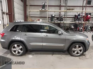 2013 Jeep Grand Cherokee Overland with VIN 1C4RJFCT9DC524605, listed as a IAAI auction lot 42016103 with 215,352 mi miles. Bid and sale history available at carsss.com. Image 13.