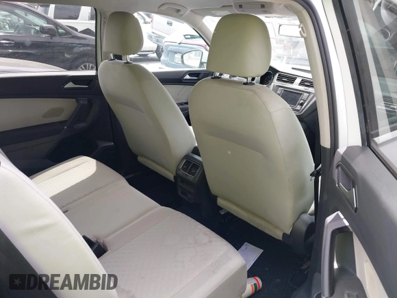 2018 Volkswagen Tiguan S with VIN 3VV1B7AX8JM032990, listed as a IAAI auction lot 42279807 with 74,185 mi miles and . Bid and sale history available at DreamBid. Image 8.