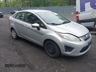 2012 Ford Fiesta SE z VIN 3FADP4BJ3CM198039, wystawiony jako IAAI lot #42273689 z przebiegiem 125 172 mil mil oraz . Historia ofert i sprzedaży dostępna na DreamBid. Obrazek 1.
