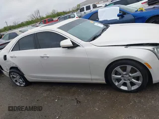 2013 Cadillac ATS z VIN 1G6AA5RX9D0156125, wystawiony jako IAAI lot #41964124 z przebiegiem 139 869 mil mil oraz . Historia ofert i sprzedaży dostępna na DreamBid. Obrazek 12.