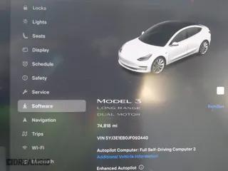2018 Tesla Model 3 Long Range Battery with VIN 5YJ3E1EB0JF092440, listed as a IAAI auction lot 41881209 with 74,818 mi miles. Bid and sale history available at carsss.com. Image 7.