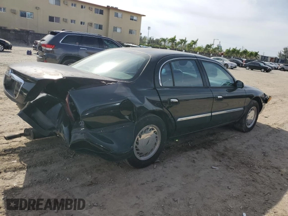 1998 Lincoln Continental with VIN 1LNFM97V8WY742639, listed as a Copart auction lot 82138303 with 268,814 mi miles and Salvage Title. Bid and sale history available at carsss.com. Image 3.