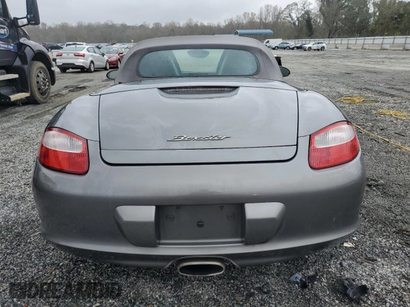 2007 Porsche Boxster z VIN WP0CA29857U711677, wystawiony jako Copart lot #79859924 z przebiegiem 83 123 mil mil oraz Szkoda całkowita • Salvage title. Historia ofert i sprzedaży dostępna na DreamBid. Obrazek 6.