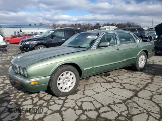 1999 Jaguar XJ with VIN SAJHX1048XC857829, listed as a Copart auction lot 83795334 with 118,100 mi miles and Salvage title. Bid and sale history available at DreamBid. Image 1.
