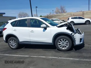 2016 Mazda CX-5 Sport with VIN JM3KE2BY9G0825285, listed as a IAAI auction lot 41841833 with 96,915 mi miles. Bid and sale history available at carsss.com. Image 13.