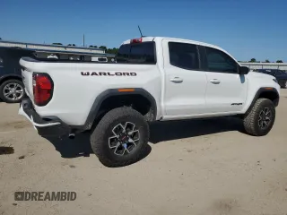 2023 GMC Canyon 4WD AT4X with VIN 1GTP6EEK6P1235222, listed as a Copart auction lot 75664684 with 9,736 mi miles and Salvage Title. Bid and sale history available at carsss.com. Image 3.