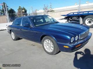 2000 Jaguar XJ with VIN SAJDA14C4YLF16529, listed as a IAAI auction lot 41387819 with 90,143 mi miles. Bid and sale history available at carsss.com. Image 1.