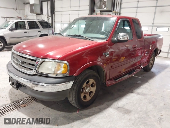 2002 Ford F-150 XL with VIN 1FTRX17L12NA36715, listed as a IAAI auction lot 41850555 with 174,012 mi miles. Bid and sale history available at carsss.com. Image 2.