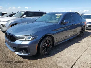 2023 BMW 5 Series M550i xDrive with VIN WBA13BK08PCN51125, listed as a Copart auction lot 76781294 with 8,855 mi miles and Non repairable. Bid and sale history available at DreamBid. Image 1.