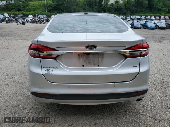2017 Ford Fusion SE z VIN 3FA6P0H72HR394609, wystawiony jako Copart lot #63386525 z przebiegiem Nie podano mil oraz Szkoda całkowita • Salvage title. Historia ofert i sprzedaży dostępna na DreamBid. Obrazek 6.