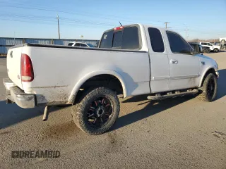2000 Ford F-150 XL with VIN 1FTRX18L3YKA09007, listed as a Copart auction lot 42828005 with 218,563 mi miles and Salvage Title. Bid and sale history available at carsss.com. Image 3.
