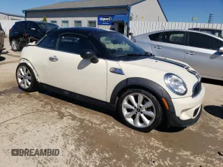 2014 MINI Coupe S z VIN WMWSX3C54ET772839, wystawiony jako Copart lot #73992794 z przebiegiem 100 580 mil mil oraz Nie do naprawy. Historia ofert i sprzedaży dostępna na DreamBid. Obrazek 4.