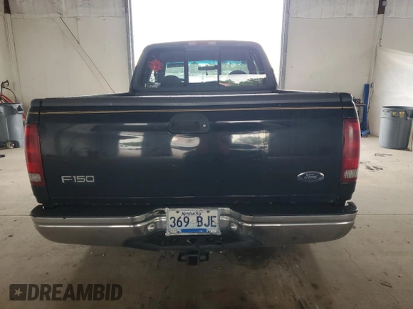 1999 Ford F-150 with VIN 1FTZX1723XNA24144, listed as a Copart auction lot 58071155 with 320,829 mi miles and Salvage title. Bid and sale history available at DreamBid. Image 6.