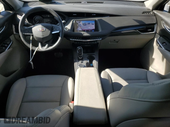 2022 Cadillac XT4 FWD Premium Luxury with VIN 1GYFZCR43NF154997, listed as a Copart auction lot 81942214 with 22,697 mi miles and Salvage title. Bid and sale history available at DreamBid. Image 8.