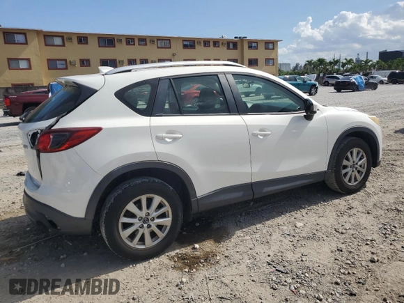2014 Mazda CX-5 Sport with VIN JM3KE2BE9E0344990, listed as a Copart auction lot 59014145 with 126,905 mi miles and Salvage title. Bid and sale history available at DreamBid. Image 3.