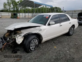 2003 Mercury Grand Marquis GS Convenience z VIN 2MEFM74WX3X633910, wystawiony jako Copart lot #52999865 z przebiegiem 207 970 mil mil oraz Szkoda całkowita • Salvage title. Historia ofert i sprzedaży dostępna na DreamBid. Obrazek 1.