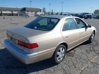2001 Toyota Camry CE with VIN JT2BG22KX10559757, listed as a IAAI auction lot 41823719 with 72,775 mi miles. Bid and sale history available at carsss.com. Image 4.