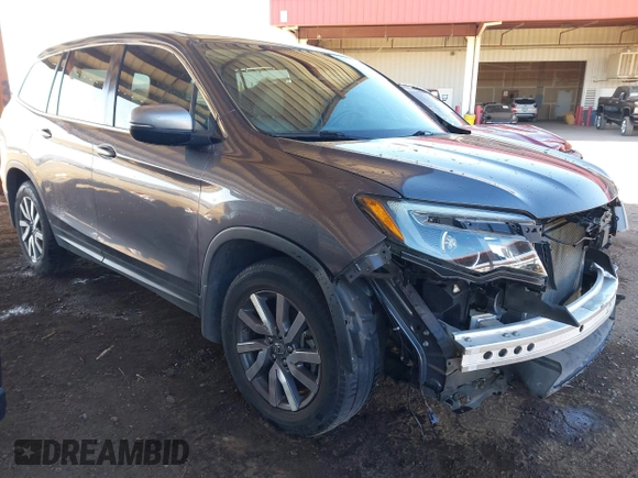 2020 Honda Pilot EX-L with VIN 5FNYF5H50LB011021, listed as a IAAI auction lot 41382249 with 113,884 mi miles. Bid and sale history available at carsss.com. Image 1.