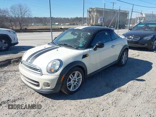2012 MINI Coupe z VIN WMWSX1C50CT163832, wystawiony jako IAAI lot #41837456 z przebiegiem 123 906 mil mil oraz . Historia ofert i sprzedaży dostępna na DreamBid. Obrazek 2.