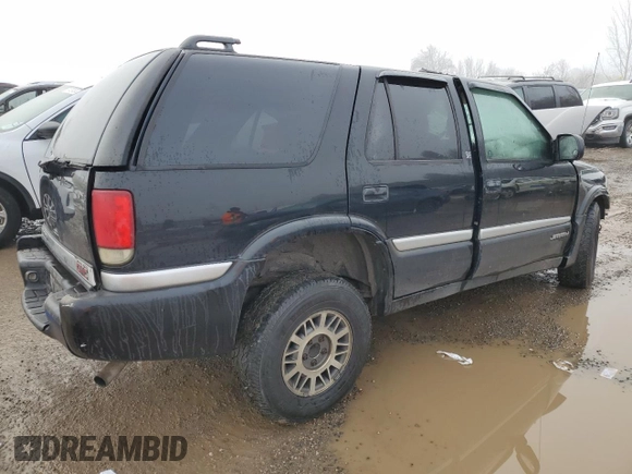 1999 GMC Jimmy SLE with VIN 1GKDT13W3X2522381, listed as a Copart auction lot 83219014 with Not Provided miles and Non Repairable. Bid and sale history available at carsss.com. Image 3.