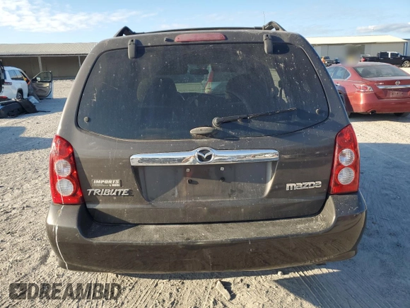 2006 Mazda Tribute S with VIN 4F2YZ04116KM23873, listed as a Copart auction lot 79926084 with 67,142 mi miles and Salvage Title. Bid and sale history available at DreamBid. Image 6.