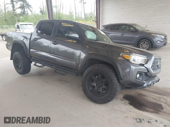 2019 Toyota Tacoma SR z VIN 3TMCZ5AN1KM257081, wystawiony jako IAAI lot #42211385 z przebiegiem 60 229 mil mil oraz . Historia ofert i sprzedaży dostępna na DreamBid. Obrazek 1.