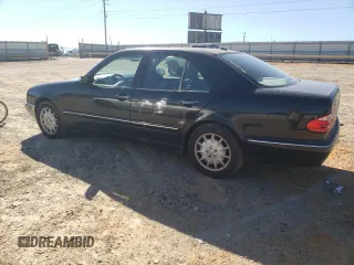 2000 Mercedes-Benz E-Class AWD with VIN WDBJF82JXYX035315, listed as a Copart auction lot 75568454 with 166,704 mi miles and Salvage Title. Bid and sale history available at carsss.com. Image 2.
