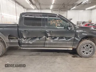 2015 Ford F-150 XLT w/HD Payload Pkg with VIN 1FTFW1EGXFFA39852, listed as a IAAI auction lot 41769971 with 163,929 mi miles. Bid and sale history available at carsss.com. Image 14.