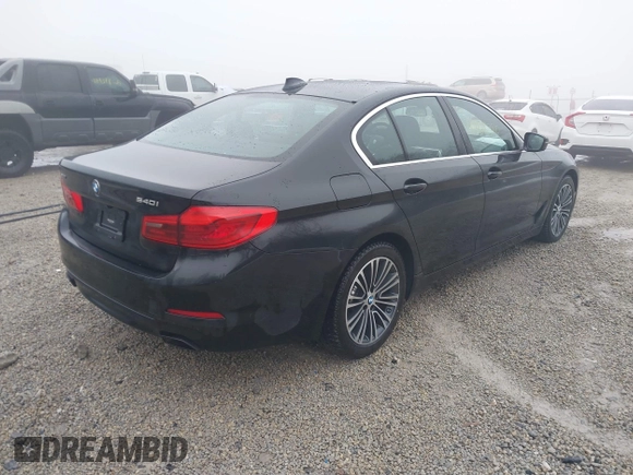 2019 BMW 5 Series 540i xDrive with VIN WBAJE7C51KWW21475, listed as a IAAI auction lot 41428380 with 53,872 mi miles and . Bid and sale history available at carsss.com. Image 4.