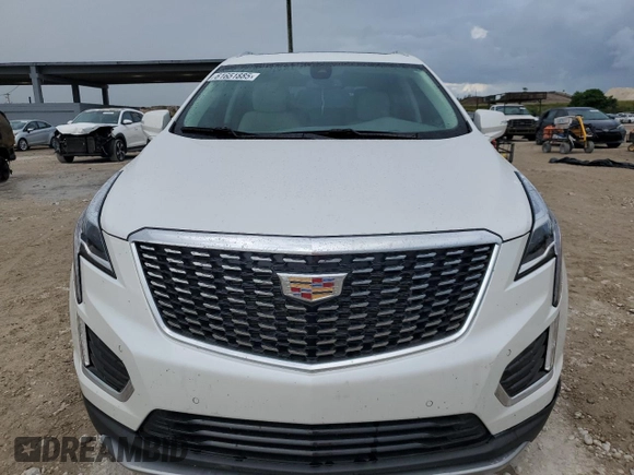 2022 Cadillac XT5 FWD Premium Luxury z VIN 1GYKNCRS0NZ175748, wystawiony jako Copart lot #61651885 z przebiegiem 13 747 mil mil oraz Szkoda całkowita • Salvage title. Historia ofert i sprzedaży dostępna na DreamBid. Obrazek 5.