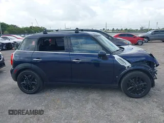 2013 MINI Countryman with VIN WMWZB3C58DWM07817, listed as a IAAI auction lot 41962291 with 60,763 mi miles and . Bid and sale history available at DreamBid. Image 14.