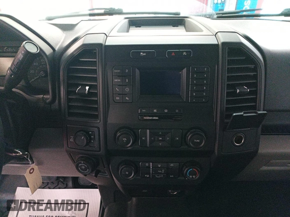 2020 Ford F-150 XL with VIN 1FTEX1EP1LKE45885, listed as a IAAI auction lot 42679224 with 124,413 mi miles and . Bid and sale history available at DreamBid. Image 2.