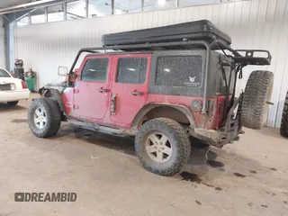 2011 Jeep Wrangler Unlimited Sport with VIN 1J4HA3H1XBL534312, listed as a IAAI auction lot 41030703 with 1 mi miles. Bid and sale history available at carsss.com. Image 3.