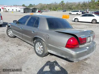 2004 Mercury Grand Marquis LS Premium with VIN 2MEFM75W14X606756, listed as a IAAI auction lot 41572470 with 106,498 mi miles. Bid and sale history available at carsss.com. Image 3.