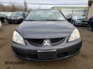 2004 Mitsubishi Lancer LS with VIN JA3AJ36E34U036316, listed as a Copart auction lot 87617655 with 140,855 mi miles and Salvage Title. Bid and sale history available at carsss.com. Image 5.