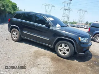 2011 Jeep Grand Cherokee Laredo with VIN 1J4RR4GG7BC596730, listed as a IAAI auction lot 42473954 with 163,674 mi miles and . Bid and sale history available at DreamBid. Image 1.