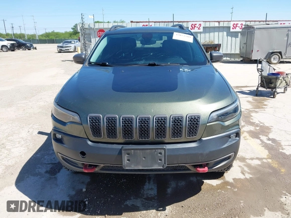 2019 Jeep Cherokee Trailhawk Elite with VIN 1C4PJMBN7KD287506, listed as a IAAI auction lot 42072589 with 108,034 mi miles and . Bid and sale history available at DreamBid. Image 12.