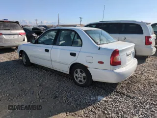 2000 Hyundai Accent z VIN KMHCG45G0YU084004, wystawiony jako Copart lot #42980585 z przebiegiem 167 545 mil mil oraz Czysty tytuł • Clean title. Historia ofert i sprzedaży dostępna na DreamBid. Obrazek 2.