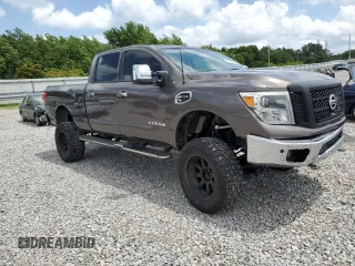 2017 Nissan Titan SL z VIN 1N6BA1F27HN547900, wystawiony jako Copart lot #61768145 z przebiegiem 148 383 mil mil oraz Szkoda całkowita • Salvage title. Historia ofert i sprzedaży dostępna na DreamBid. Obrazek 4.
