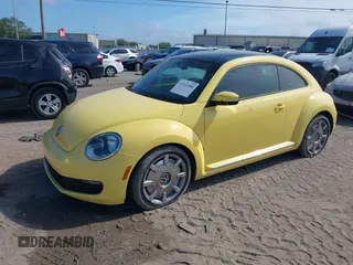2012 Volkswagen Beetle 2.5L with VIN 3VWJX7AT9CM651806, listed as a IAAI auction lot 41912080 with 143,195 mi miles. Bid and sale history available at carsss.com. Image 2.