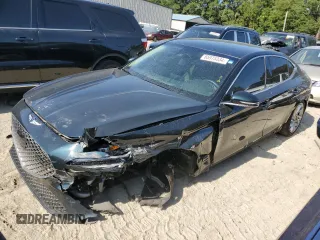 2022 Genesis G70 2.0T with VIN KMTG34TA0NU103101, listed as a Copart auction lot 65975334 with 52,723 mi miles and Salvage Title. Bid and sale history available at carsss.com. Image 1.
