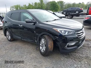 2018 Hyundai Santa Fe 2.0T z VIN 5NMZUDLA3JH057978, wystawiony jako IAAI lot #41930580 z przebiegiem 118 100 mil mil oraz . Historia ofert i sprzedaży dostępna na DreamBid. Obrazek 1.