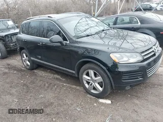 2012 Volkswagen Touareg Sport with VIN WVGFK9BP7CD002243, listed as a IAAI auction lot 41863765 with 136,231 mi miles and . Bid and sale history available at DreamBid. Image 1.