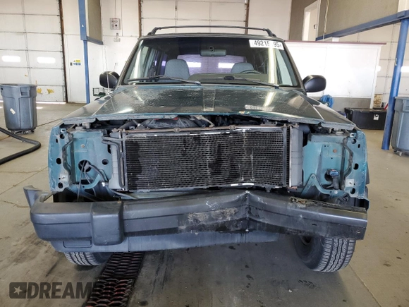 1997 Jeep Cherokee SE with VIN 1J4FJ28S0VL551442, listed as a Copart auction lot 49215195 with 164,356 mi miles and Salvage Title. Bid and sale history available at carsss.com. Image 5.