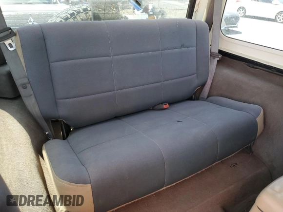 1999 Jeep Wrangler Sahara with VIN 1J4FY49S8XP472733, listed as a Copart auction lot 58174915 with 170,838 mi miles and Salvage title. Bid and sale history available at DreamBid. Image 11.