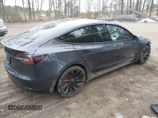 2021 Tesla Model 3 Performance with VIN 5YJ3E1EC1MF925515, listed as a IAAI auction lot 41721548 with 36,478 mi miles and . Bid and sale history available at carsss.com. Image 4.