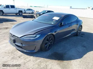 2022 Tesla Model S with VIN 5YJSA1E57NF467229, listed as a IAAI auction lot 41765897 with 1 mi miles. Bid and sale history available at carsss.com. Image 2.