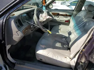 1999 Mercury Grand Marquis LS z VIN 2MEFM75W1XX635839, wystawiony jako Copart lot #55860735 z przebiegiem 114 963 mil mil oraz Szkody całkowita. Historia ofert i sprzedaży dostępna na DreamBid. Obrazek 7.